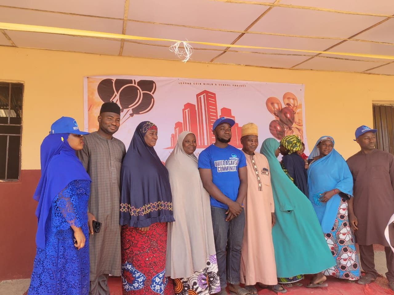 Guests and organizers posing together during the school launch event